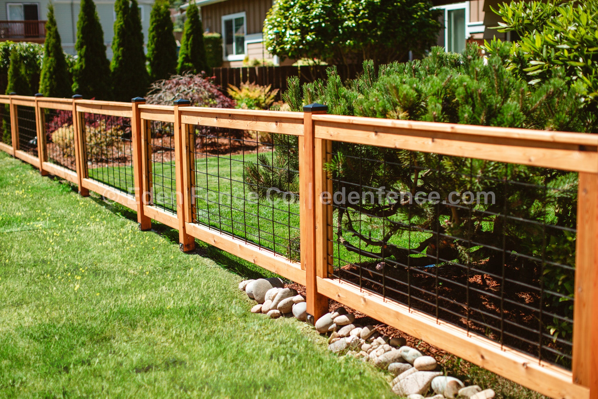 DIY fence panel installation using cedar and Douglas Fir hog panels in a Seattle backyard. Eden Fence Co. Pacific Northwest style, easy-to-install fencing.