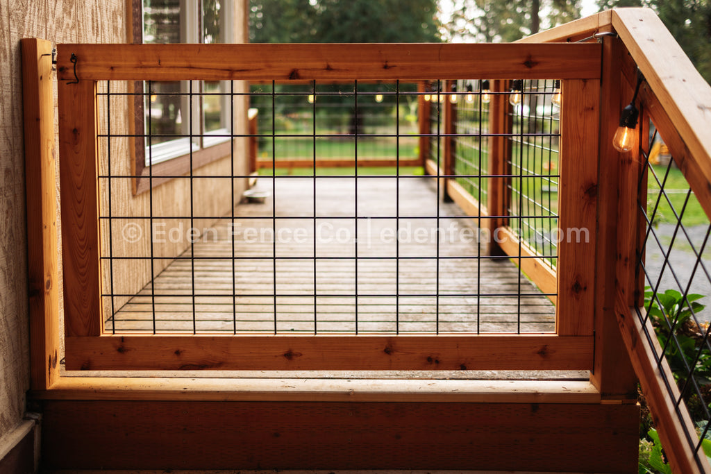Eden Fence Co hog panel deck railing gate with metal grid design and string lights in Woodinville, Washington